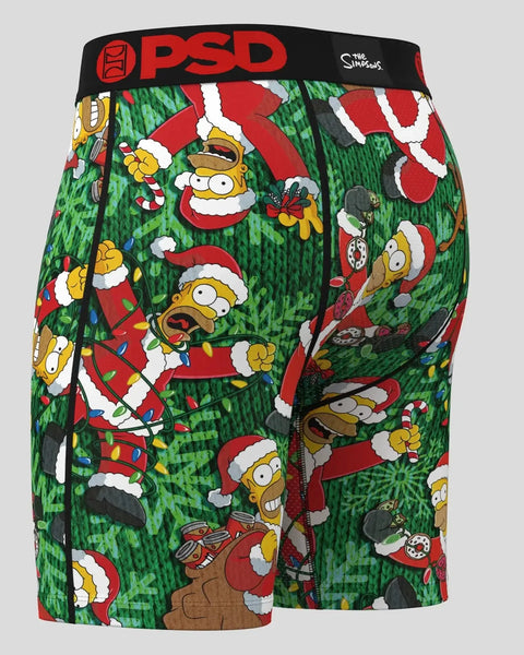 Green and red Simpsons boxer shorts with cartoon characters in Santa hats and holiday patterns, black PSD waistband.