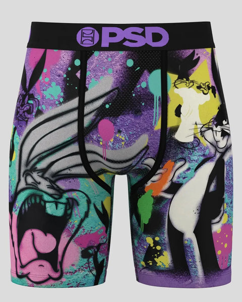 PSD brand boxer shorts with Bugs Bunny character and colorful abstract splatter design on black and purple background.