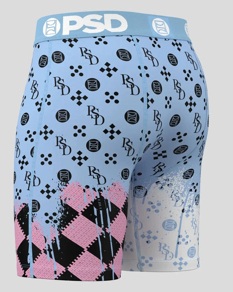 PSD boxer briefs with light blue upper half featuring black geometric logos and pink argyle pattern on lower leg.