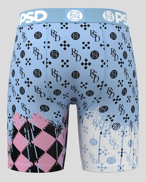 Light blue boxer briefs with black logo pattern, pink and black argyle design on left leg, blue splatter effect on right leg.