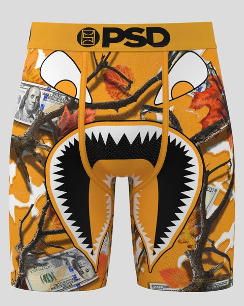 PSD brand underwear with orange and gold pumpkin-themed graphic design featuring a monster face with black spiky teeth and wh