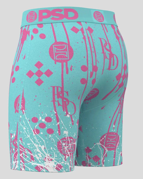 Turquoise and pink PSD boxer shorts with geometric and abstract splatter print design.