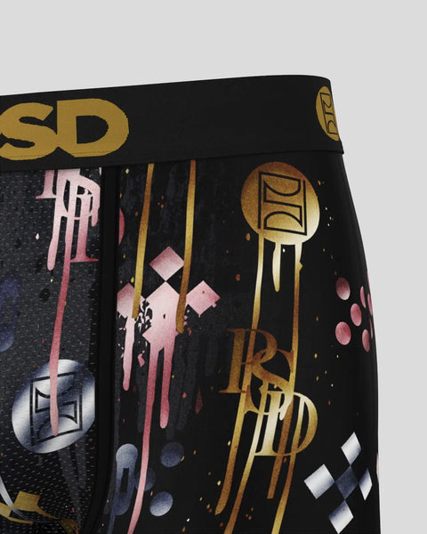 Black boxer briefs with gold and pink metallic graphic design and text print throughout.