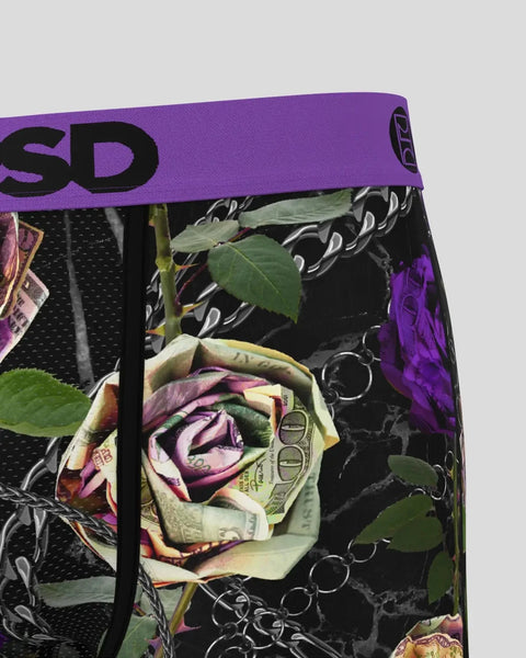 Purple waistband with black text on black fabric featuring colorful roses, currency, and decorative chain patterns.