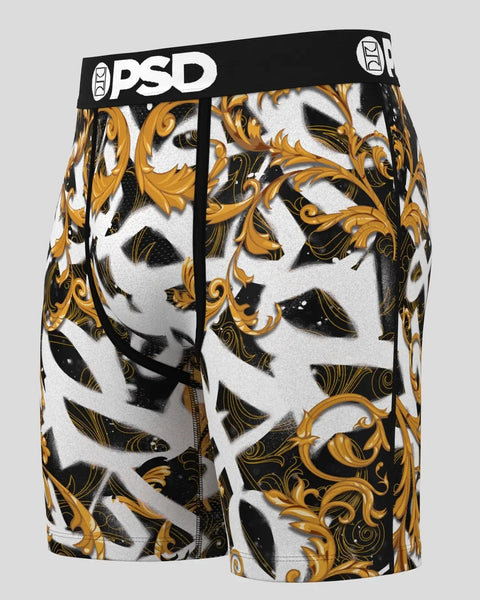 PSD brand boxer briefs with gold, black, and white baroque scroll pattern and black waistband.