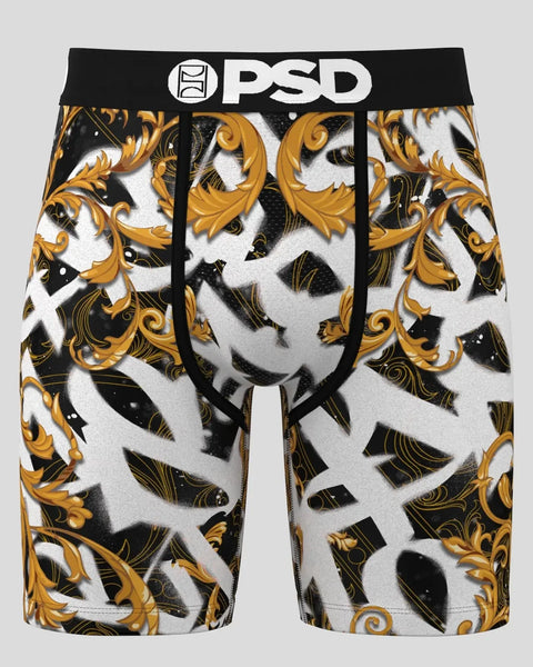 PSD brand boxer shorts with black waistband and all-over gold, black, and white baroque scroll pattern.