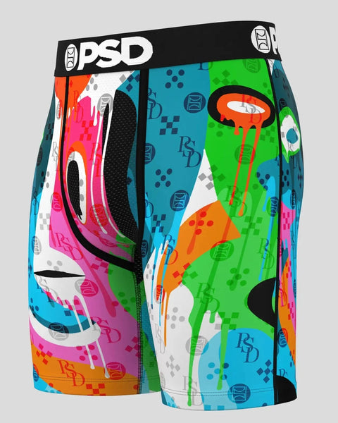 PSD boxer briefs with black waistband and colorful abstract geometric pattern in pink, green, blue, and orange.