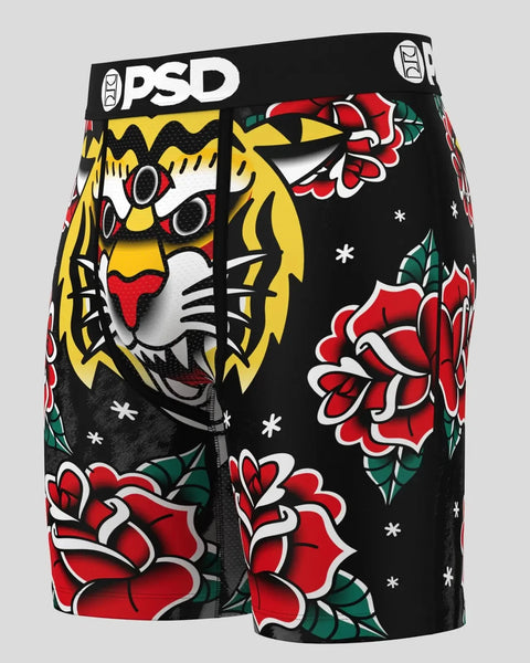 Black PSD boxer briefs with yellow three-eyed lion head and red roses with green leaves tattoo-style design.