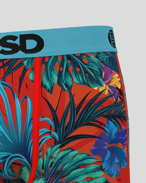 Red swim briefs with tropical floral print in teal, purple, and yellow, featuring turquoise waistband with black branding.