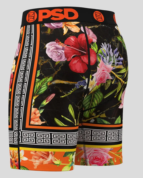 Black shorts with multicolored floral print, orange and white geometric trim, and PSD branding waistband.