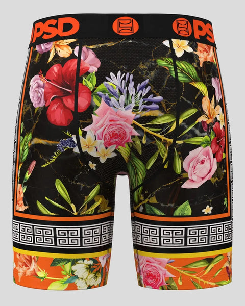 Men's athletic shorts with black base, multicolored floral print, orange PSD waistband, and geometric pattern trim.