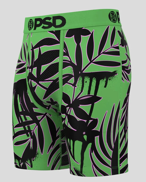 Bright green PSD boxer briefs with black daisy silhouettes and purple paint splatter details throughout.