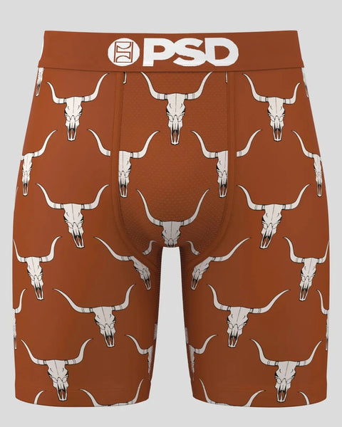 Rust-brown PSD boxer shorts with repeating white bull skull and horn print throughout.
