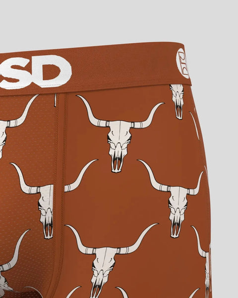 Brown shorts with repeating white longhorn skull pattern and SD brand waistband.