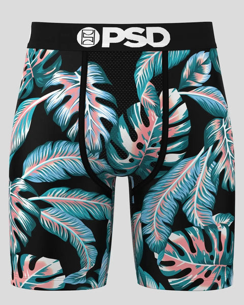 PSD boxer briefs with black waistband and tropical leaf pattern in teal, pink, and white on black background.