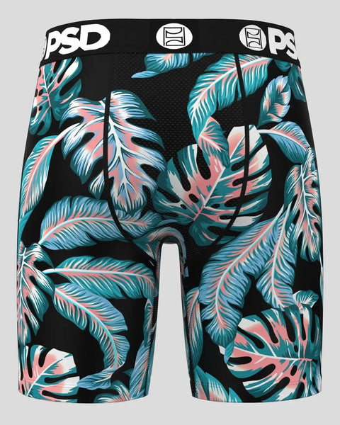 Black shorts with tropical leaf pattern in teal, pink, and white; PSD branding on waistband.