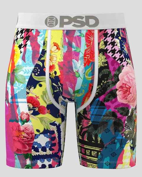 Colorful patchwork boxer briefs with floral, houndstooth, and geometric patterns in pink, yellow, blue, and black with gray w