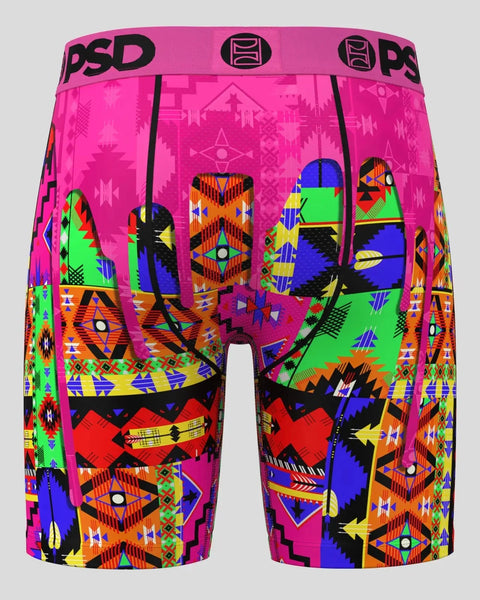 Pink boxer briefs with multicolored tribal geometric patterns in blue, green, orange, yellow, and black throughout.