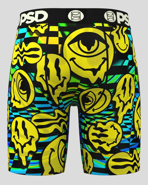 PSD brand boxer shorts with yellow cartoon faces and cyan, green, and black geometric pattern.