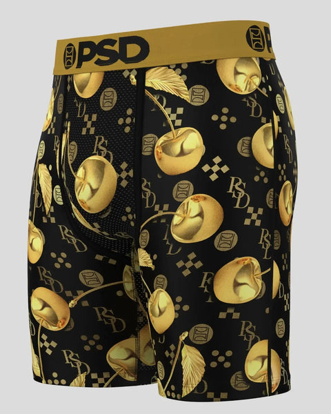 Black shorts with gold cherry pattern, PSD waistband, and geometric design elements.