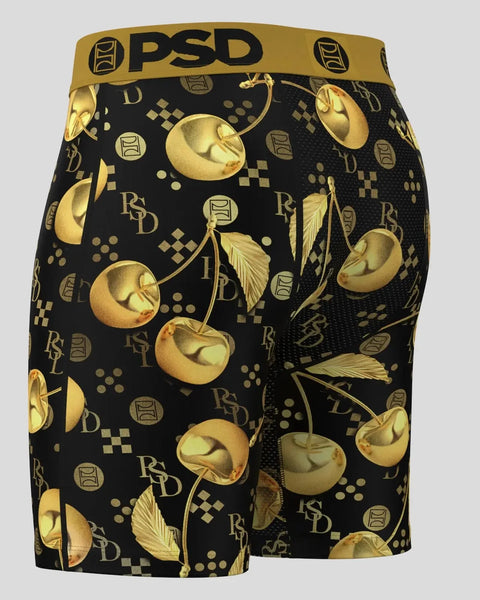 PSD boxer briefs with gold cherry and leaf pattern on black background with brand logos.
