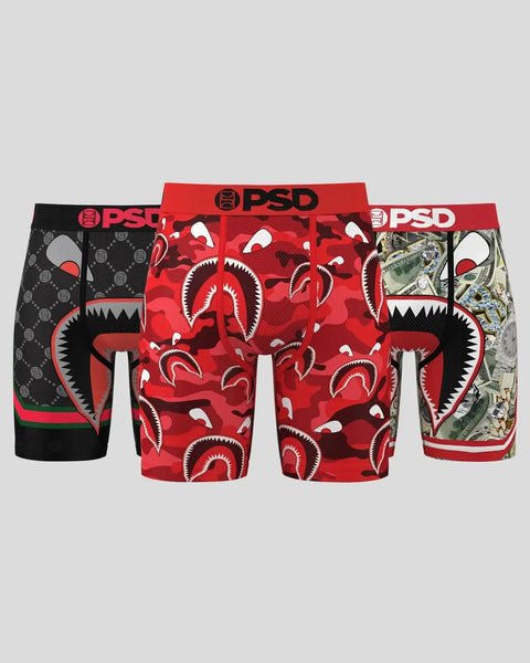 Three PSD boxer briefs with black waistbands in red shark print, black geometric, and money print designs.