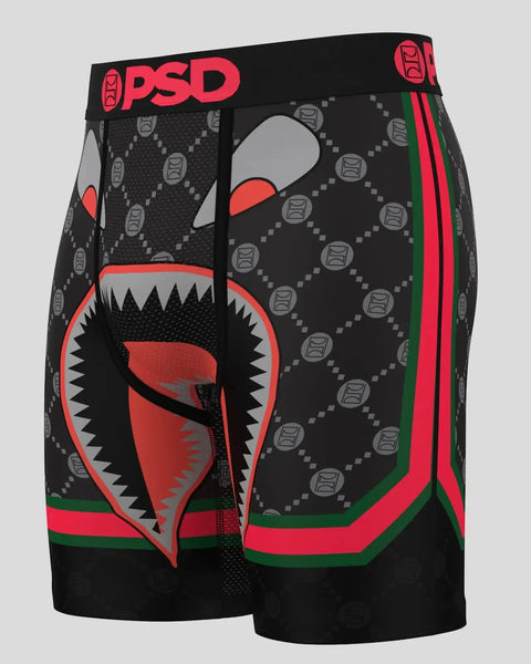 PSD brand black boxer briefs with red aggressive face design, gray geometric pattern, and red and green side stripe.
