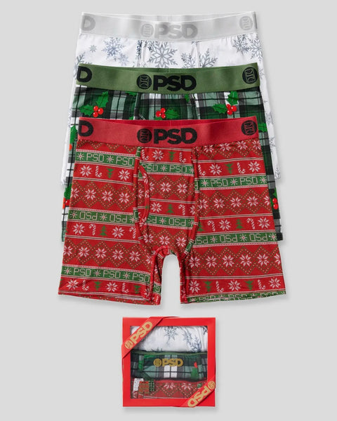 Three modal boxers with snowflake and holiday plaid patterns in white, green, and red with PSD waistbands.