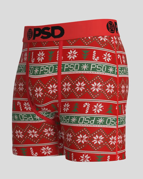 Red modal boxer shorts with white snowflakes, green trees, and PSD branding in a fair isle knit pattern.