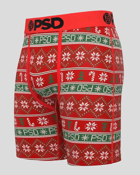Red and green knit sweater with white snowflake pattern, geometric designs, and 