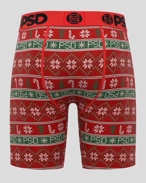 Red and green knit boxer briefs with white snowflakes, geometric patterns, and PSD branding in horizontal stripes.