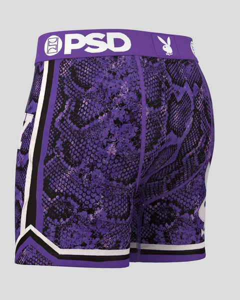 Purple and black snake-pattern shorts with PSD waistband and white stripe trim.