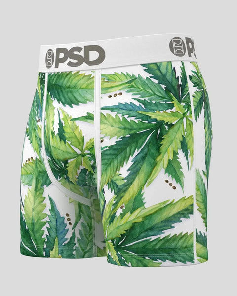 White underwear with large green leaf print and brown seeds scattered throughout, PSD waistband visible.