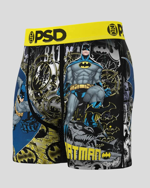 PSD boxer briefs with yellow waistband featuring Batman character artwork and bat symbols in blue, black, and gold.