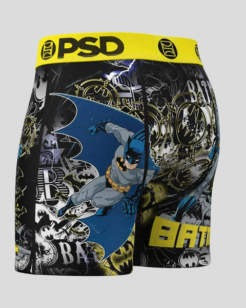 Black and yellow PSD boxer briefs with Batman character illustration, bat symbol, and comic-style graphics throughout.
