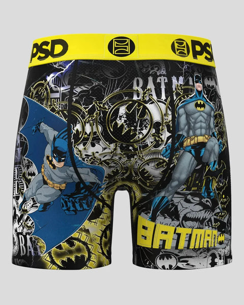 Black boxer briefs with yellow PSD waistband featuring Batman illustrations, text, and bat symbols throughout.