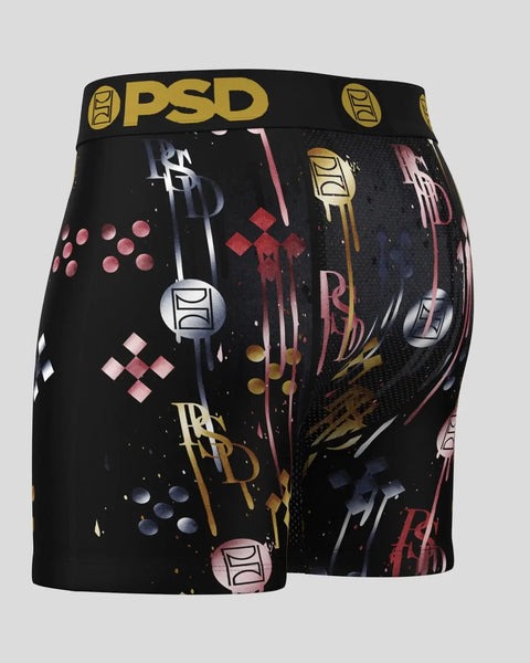 Black PSD boxer shorts with gold waistband and multicolored geometric and abstract print design throughout.
