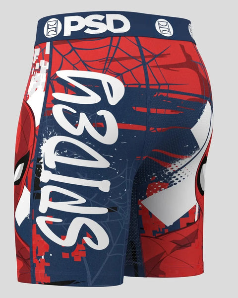 Red and navy Spider-Man shorts with web pattern, PSD waistband, and white curved logo on leg.