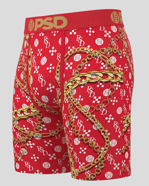 Three-pack red boxer briefs with PSD waistband, gold chain and geometric patterns, and repeating logo print.