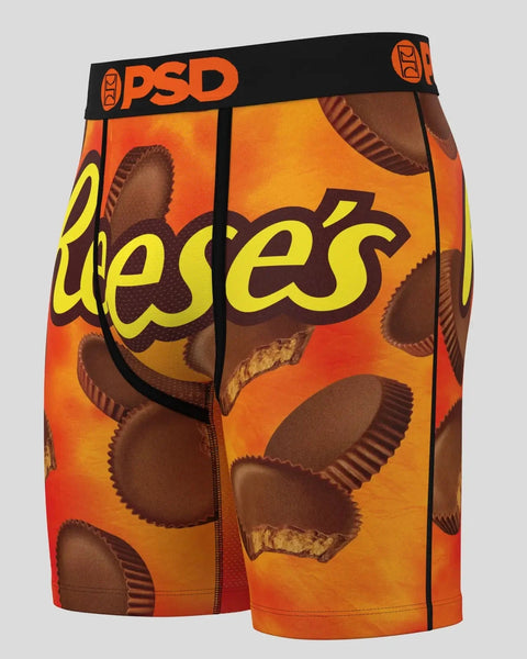 PSD boxer shorts with Reese's peanut butter cup print in orange and brown colors.