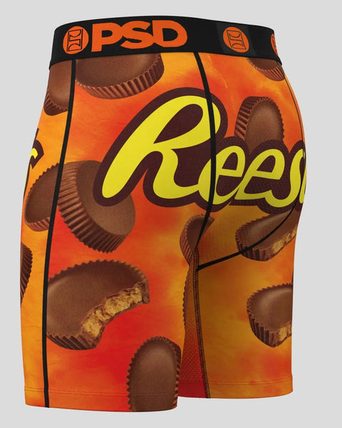 PSD boxer briefs with Reese's peanut butter cup print on orange and red background.