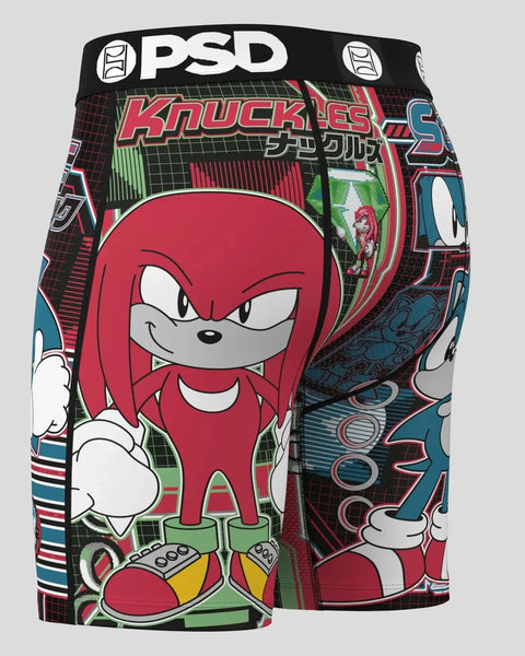 PSD boxer shorts featuring Knuckles and Sonic characters in red, blue, and green with grid pattern background.
