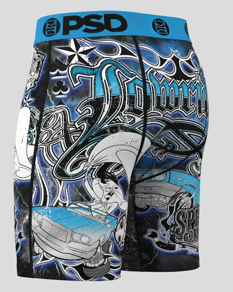 PSD blue and black shorts featuring Speedy Gonzales cartoon character with decorative graphic patterns and blue waistband.