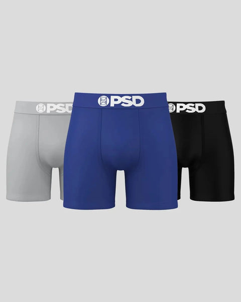 Three PSD boxer briefs in gray, royal blue, and black with white logo waistbands.