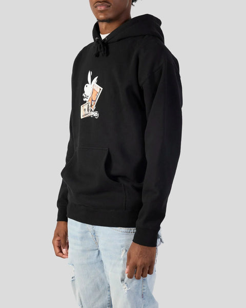 Black hoodie with white and tan Playboy bunny logo graphic on chest, drawstring hood, and kangaroo pocket.