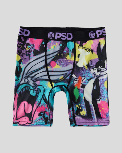 PSD brand boxer shorts with Bugs Bunny character design in neon colors including pink, purple, cyan, and yellow on black fabr