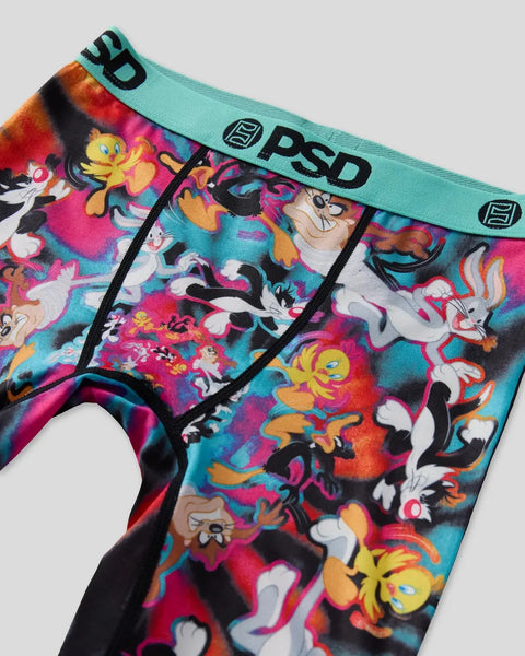 Colorful Looney Tunes characters printed on PSD brand underwear with turquoise waistband and black trim.