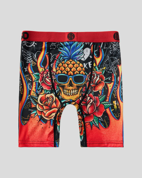 Men's boxer briefs with red waistband featuring a skull with pineapple head, roses, and colorful tattoo-style artwork on blac
