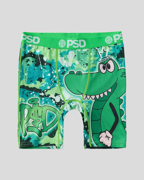 Green and teal boxer briefs with cartoon crocodile character and splatter pattern, PSD waistband.