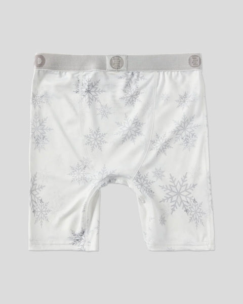 White boxer briefs with gray snowflake pattern throughout and gray elastic waistband.
